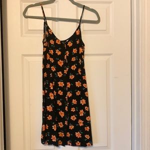 H&M Divided black and orange floral print dress seen on  Outer Banks.